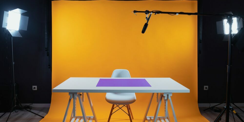 a photo studio with a table and chairs