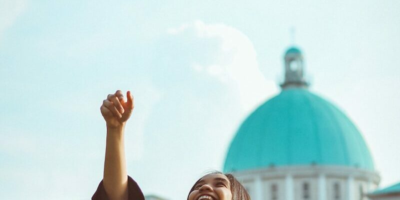woman throwing her academic hat